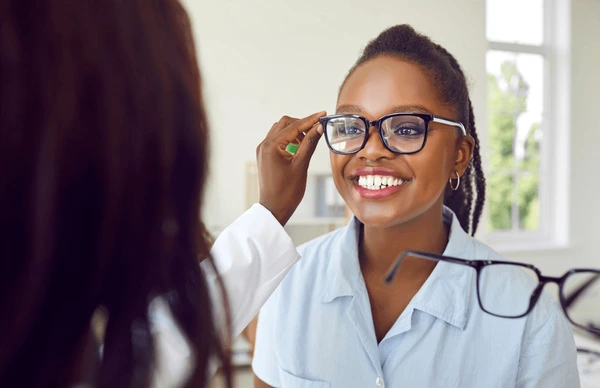 Happy patient at eye care consultation in NYC - Trapeze LASIK matching